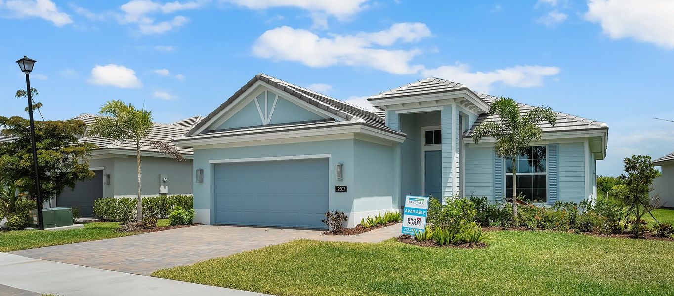 Front exterior of a new home in Lake Park at Tradition, Port St. Lucie, FL, highlighting curb appeal (Image 1).