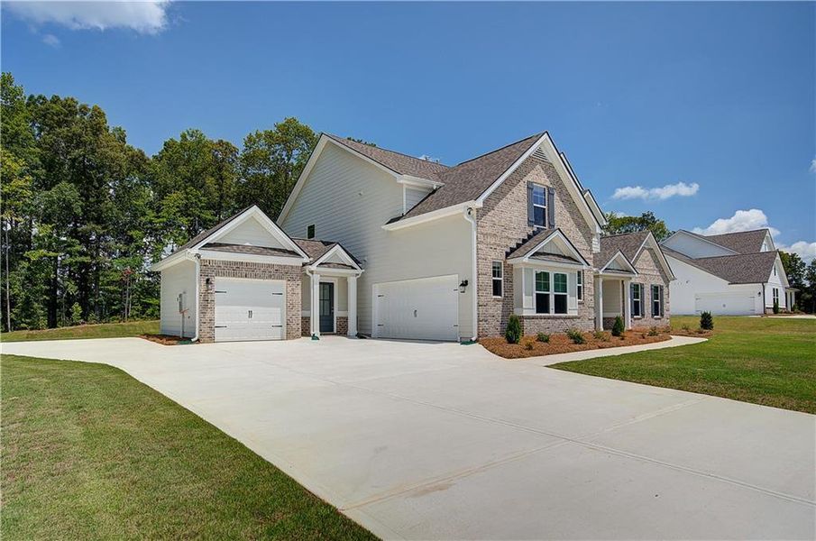Front exterior of a new home in , Senoia, GA, highlighting curb appeal (Image 21).