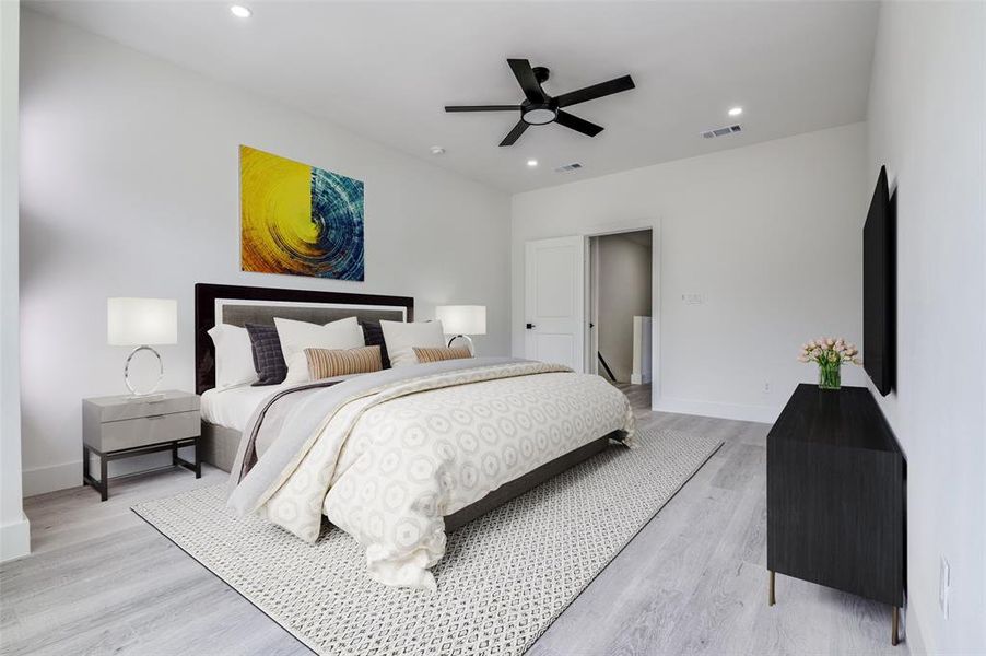 Bedroom with light wood-style floors, recessed lighting, and a ceiling fan Bedroom with light wood-style floors, recessed lighting, and a ceiling fan