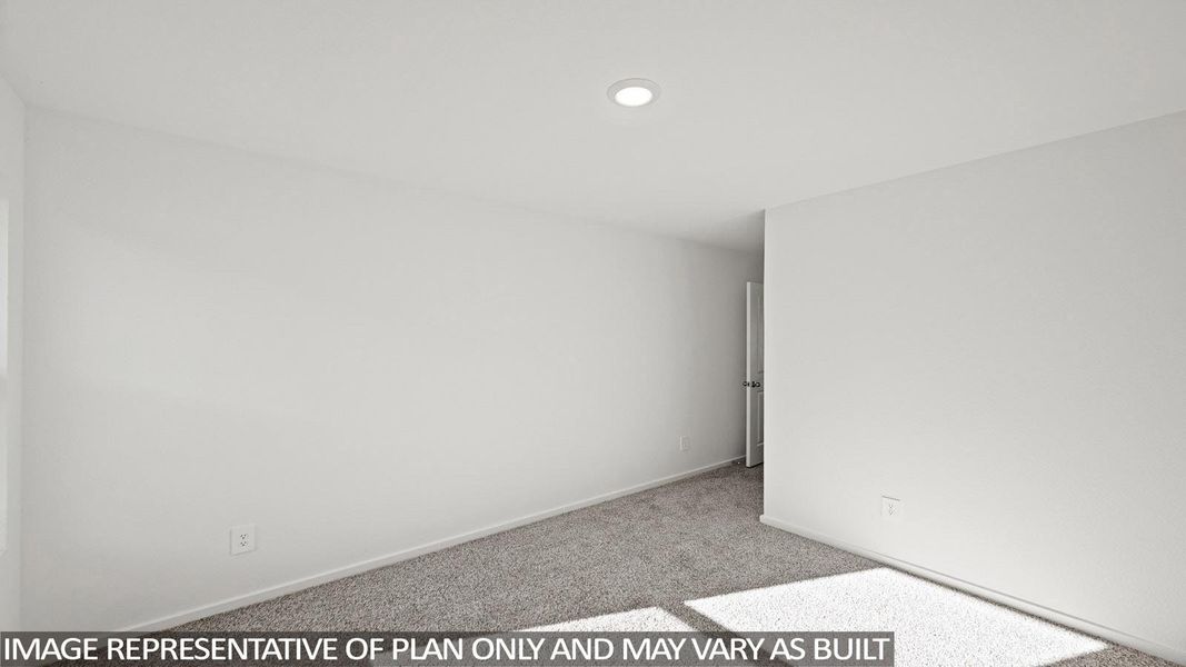 Spare room with light colored carpet and baseboards