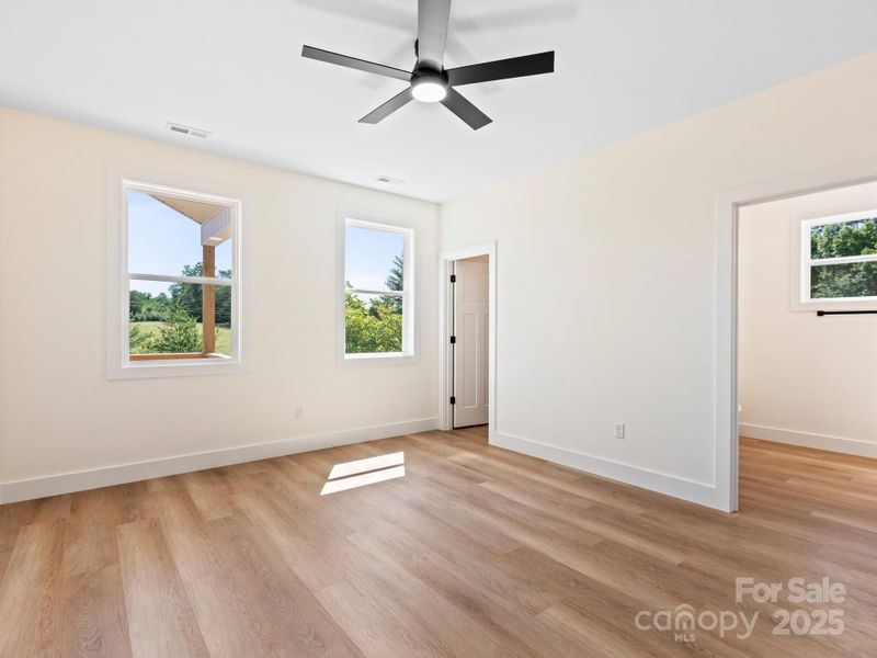The primary bedroom feels luxurious with a  walk in closet and on suite bathroom.