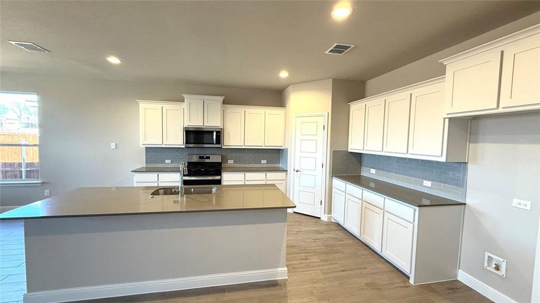 kitchen - All Home and community information, including pricing, included features, terms, availability and amenities, are subject to change at any time without notice or obligation. All Drawings, pictures, photographs, video, square footages, floor plans, elevations, features, colors and sizes are approximate for illustration purposes only and will vary from the homes as built.