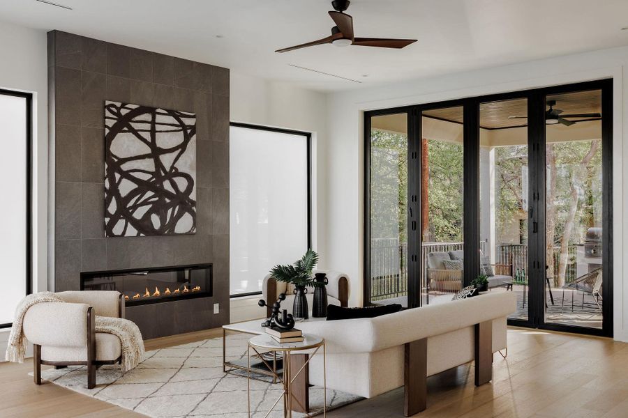 The living room showcases soaring ceilings, refined finishes, and a strong indoor-outdoor connection. The living room showcases soaring ceilings, refined finishes, and a strong indoor-outdoor connection.