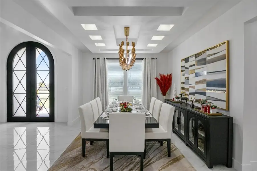 Dining space featuring french doors and a chandelier Dining space featuring french doors and a chandelier