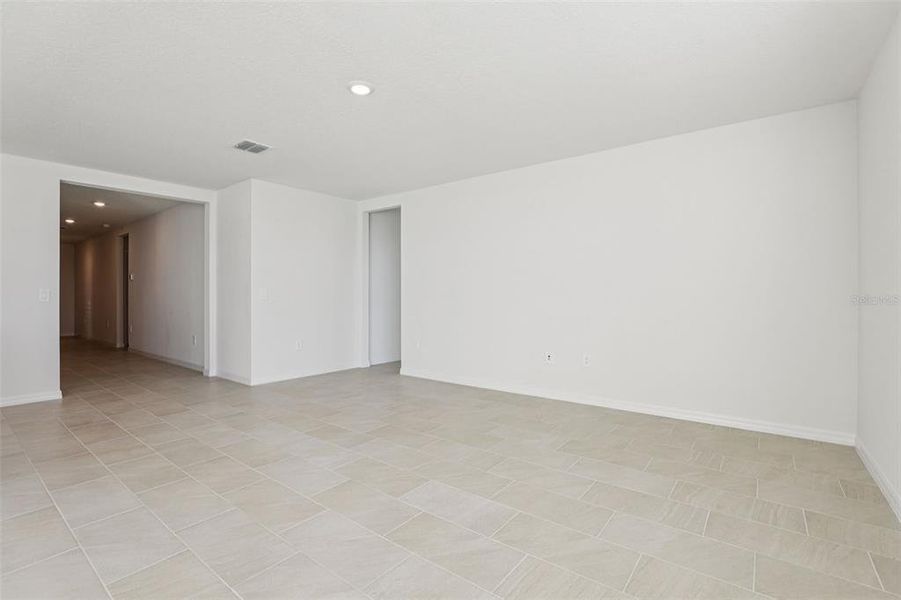 Spacious, unfurnished interior of a new home in Lake Deer Estates - Signature Series, Poinciana (Image 32).