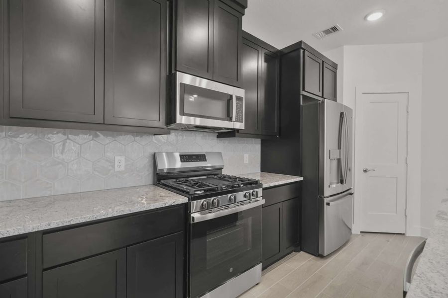 Representative furnished interior of a home built from the Carriagehouse by Chesmar Homes in Meridiana Townhomes, Iowa Colony (Image 55).