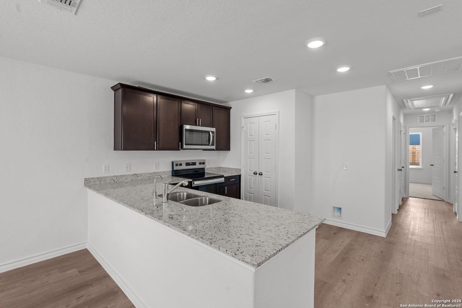 Furnished interior view inside a new home in Vista Real, Converse (Image 9).