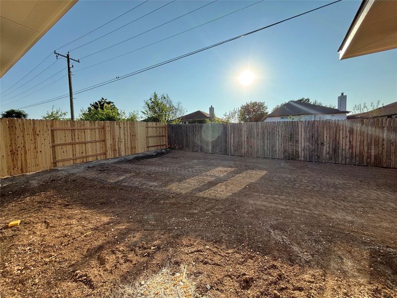 Front exterior of a new home in Covered Bridge, Hutto, TX, highlighting curb appeal (Image 2). Front exterior of a new home in Covered Bridge, Hutto, TX, highlighting curb appeal (Image 2).