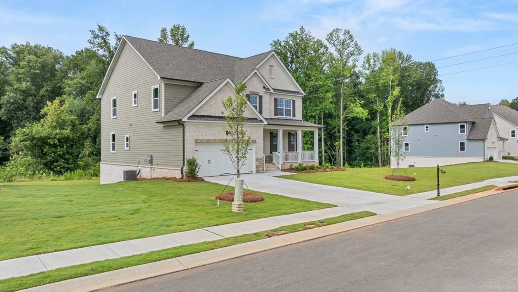 Representative exterior photo of a completed home built from the Lynnbrook by D.R. Horton in Haven Abbey, Cumming, GA (Image 2).