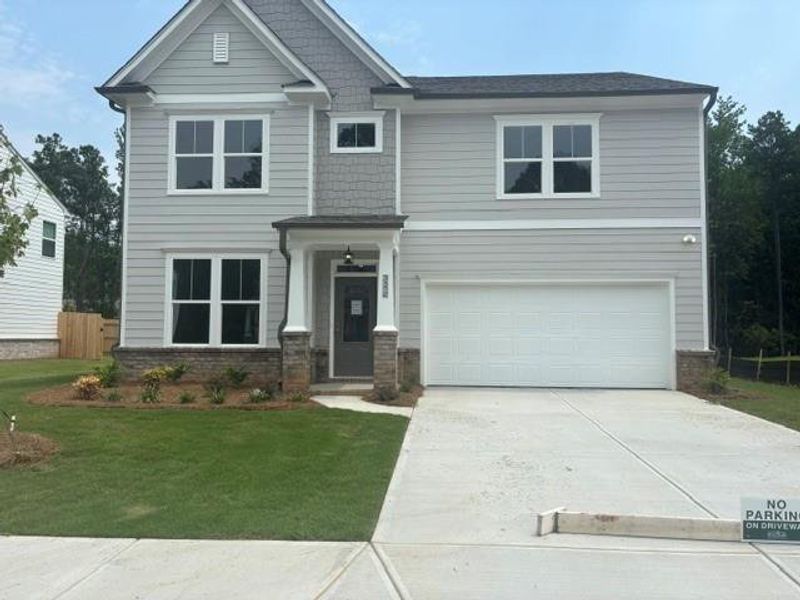 Front exterior of a new home in Edenglen, Buford, GA, highlighting curb appeal (Image 1). Front exterior of a new home in Edenglen, Buford, GA, highlighting curb appeal (Image 1).