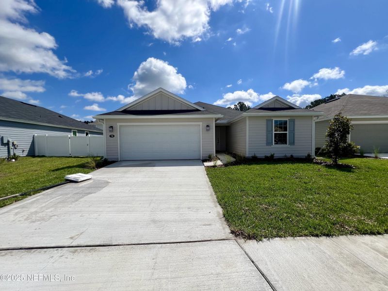 Front exterior of a new home in , Jacksonville, FL, highlighting curb appeal (Image 1).