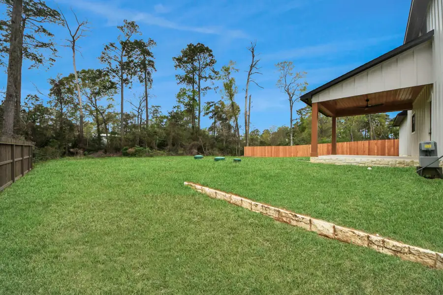 Expansive  backyard offering plenty of open green space—perfect for outdoor entertaining, pets, and play.