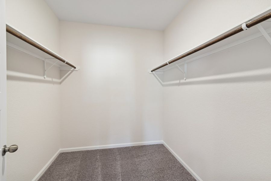 The Crawford- Primary Suite Walk-In Closet. Home under construction, sample photo used for illustrative purposes only, colors and options will vary.