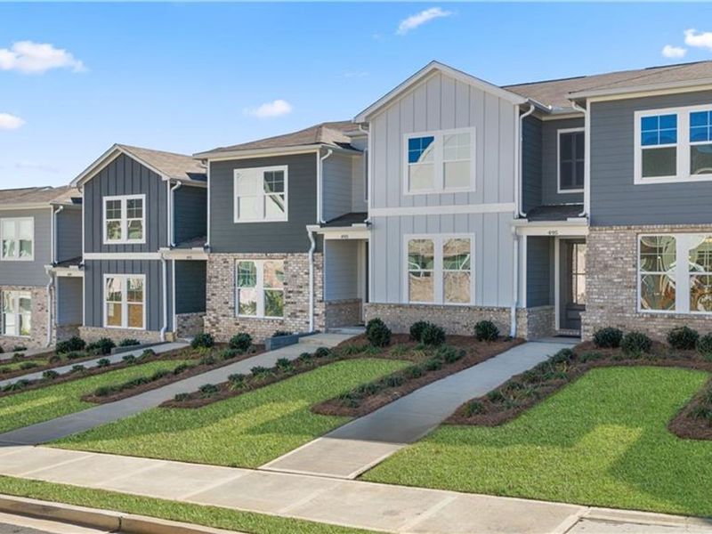 Front exterior of a new home in Stegall Village, Emerson, GA, highlighting curb appeal (Image 2). Front exterior of a new home in Stegall Village, Emerson, GA, highlighting curb appeal (Image 2).