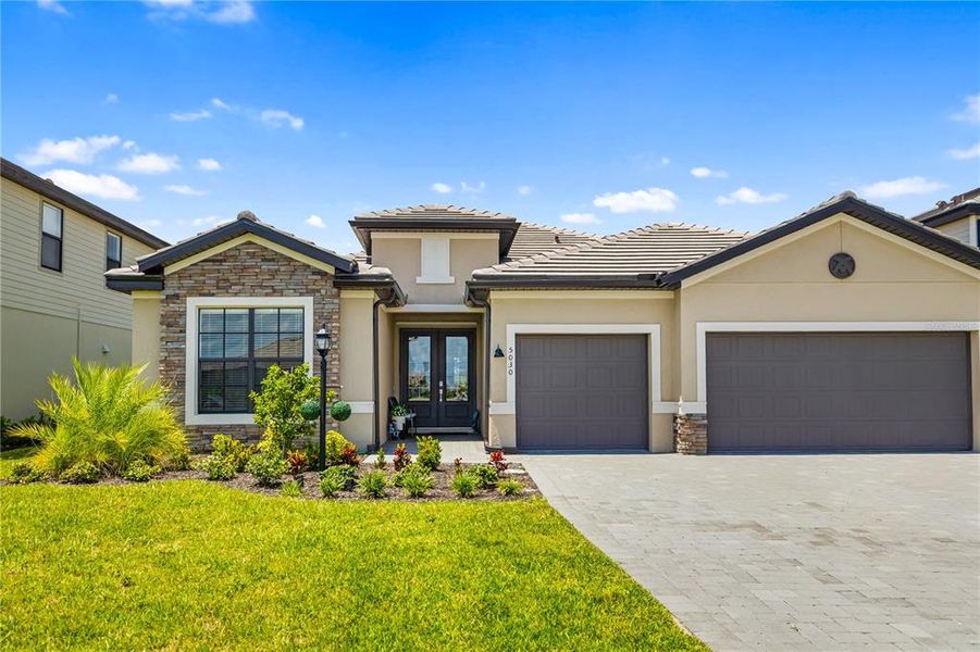 Front exterior of a new home in , Bradenton, FL, highlighting curb appeal (Image 21).