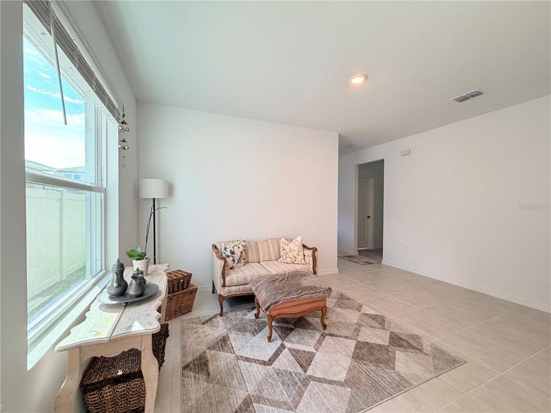 Furnished interior view inside a new home in Westview Community Group Page, Kissimmee (Image 6).