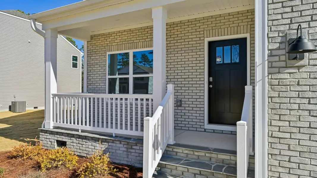 Exterior details and patio area of a home in Gretchen Pines, West End (Image 3).