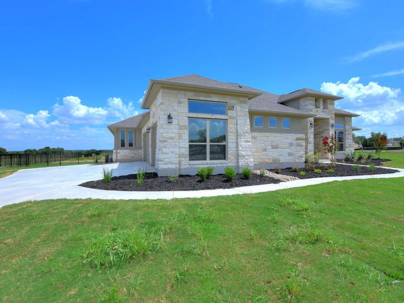 Representative exterior photo of a completed home built from the San Simeon I by Giddens Homes in Clearwater Ranch, Liberty Hill, TX (Image 57).