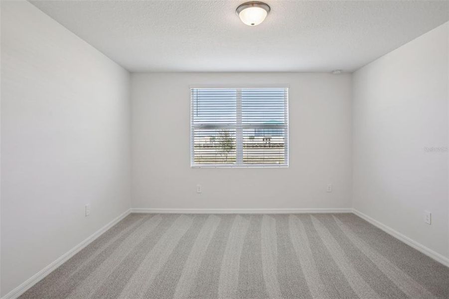 Spacious, unfurnished interior of a new home in Villamar - Signature Series, Winter Haven (Image 15).