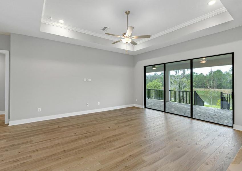 The living room has access to the covered outdoor kitchen.