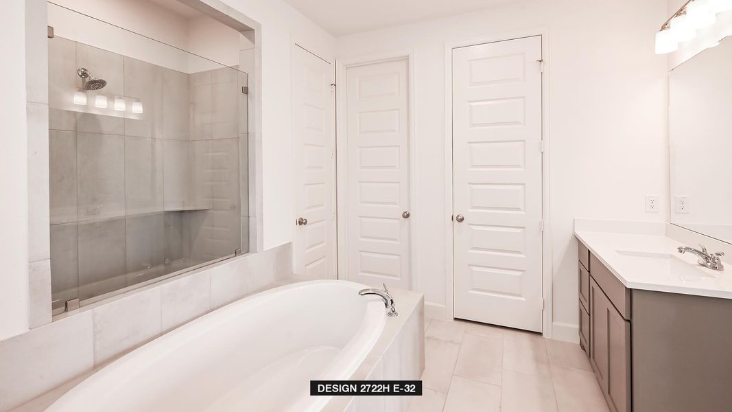 Full bathroom featuring vanity, a stall shower, tile patterned floors, and a garden tub