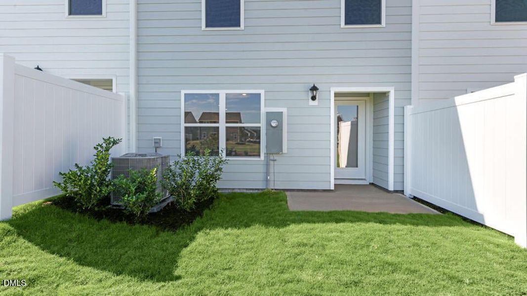 Exterior details and patio area of a home in The Townes at Ridgewood Farms, Winterville (Image 25).