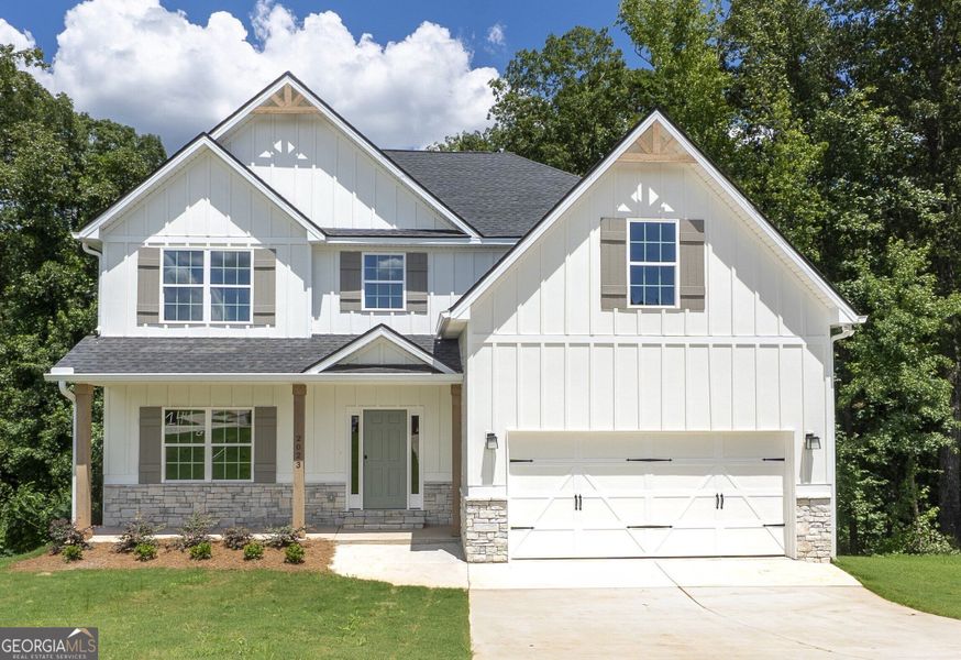 Front exterior of a new home in Juliette Crossing, Forsyth, GA, highlighting curb appeal (Image 1).