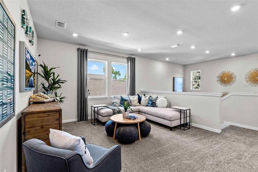 Furnished interior view inside a new home in The Cypress Series at Reserve East, Flagler Beach (Image 20).