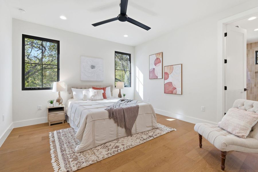 Bedroom featuring light wood-style floors, ceiling fan, and recessed lighting
