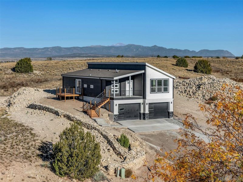 Modern exterior with dark siding, a split-entry layout, and multiple decks—perfect for enjoying panoramic mountain views Modern exterior with dark siding, a split-entry layout, and multiple decks—perfect for enjoying panoramic mountain views