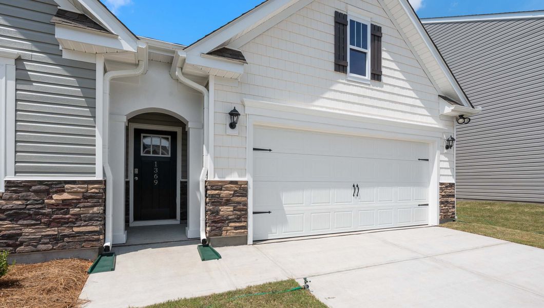 Exterior details and patio area of a home in Durbin Meadows Traditions, Fountain Inn (Image 2). Exterior details and patio area of a home in Durbin Meadows Traditions, Fountain Inn (Image 2).