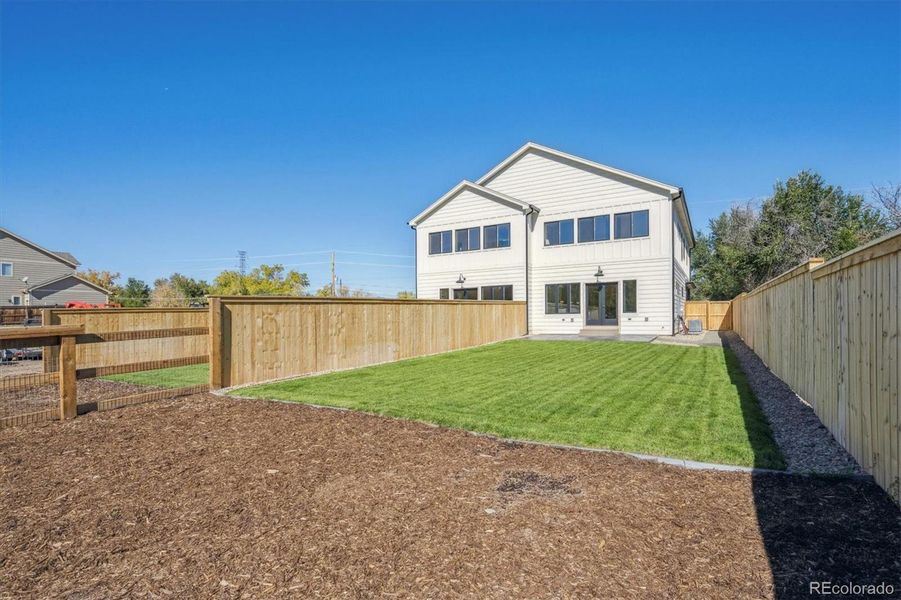 Large backyard with sprinkler system