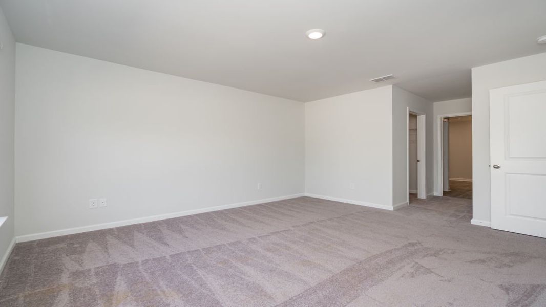 Representative unfurnished interior of a home built from the ARIA by D.R. Horton in Stanbury Creek, Supply (Image 25).