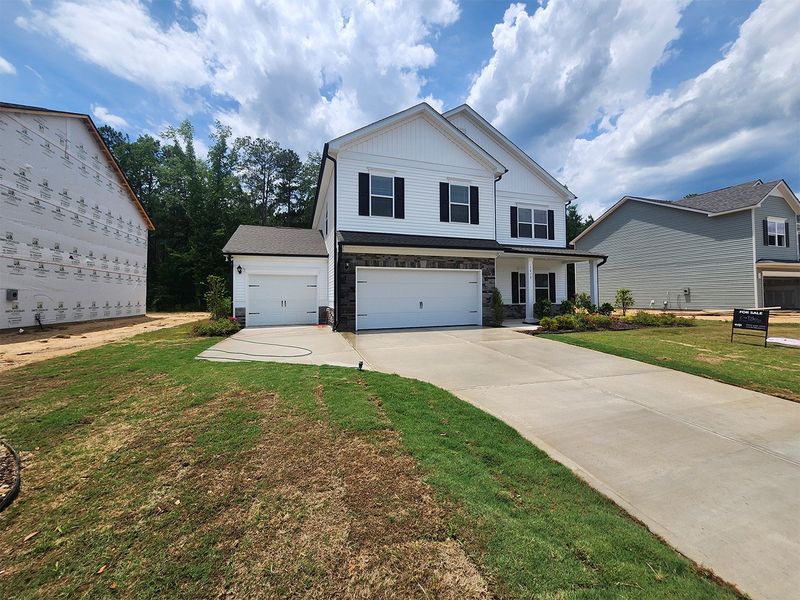 Front exterior of a new home in Lexington Woods South, Fayetteville, NC, highlighting curb appeal (Image 2).