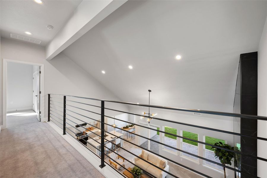 Hallway featuring recessed lighting, carpet, and a chandelier