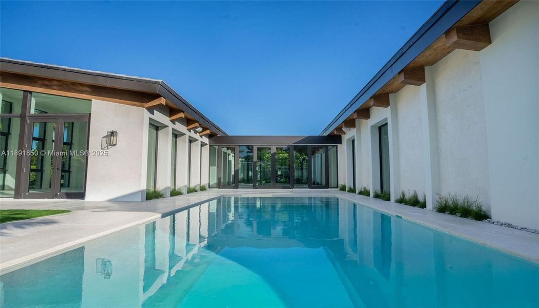 Exterior details and patio area of a home in , Coral Gables (Image 24).