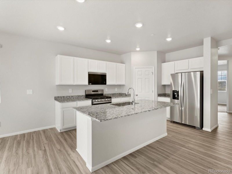 Furnished interior view inside a new home in Buffalo Highlands: The Flora Collection, Commerce City (Image 9).