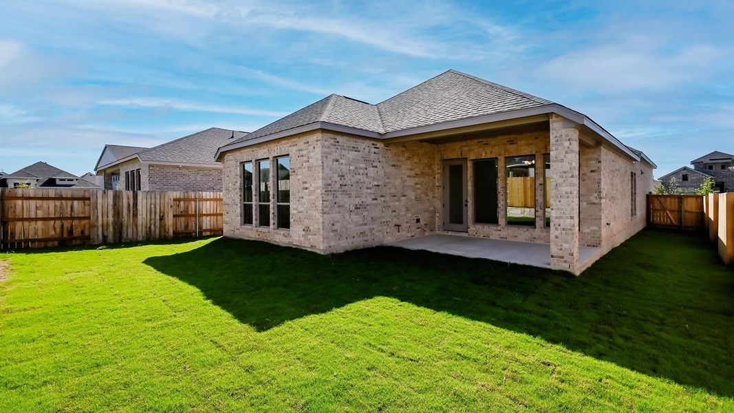 Front exterior of a new home in Crosswinds 50', Kyle, TX, highlighting curb appeal (Image 2). Front exterior of a new home in Crosswinds 50', Kyle, TX, highlighting curb appeal (Image 2).