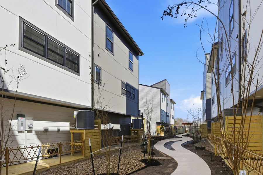 Showcasing the neighborhood layout and landscaped interior walkways. Showcasing the neighborhood layout and landscaped interior walkways.