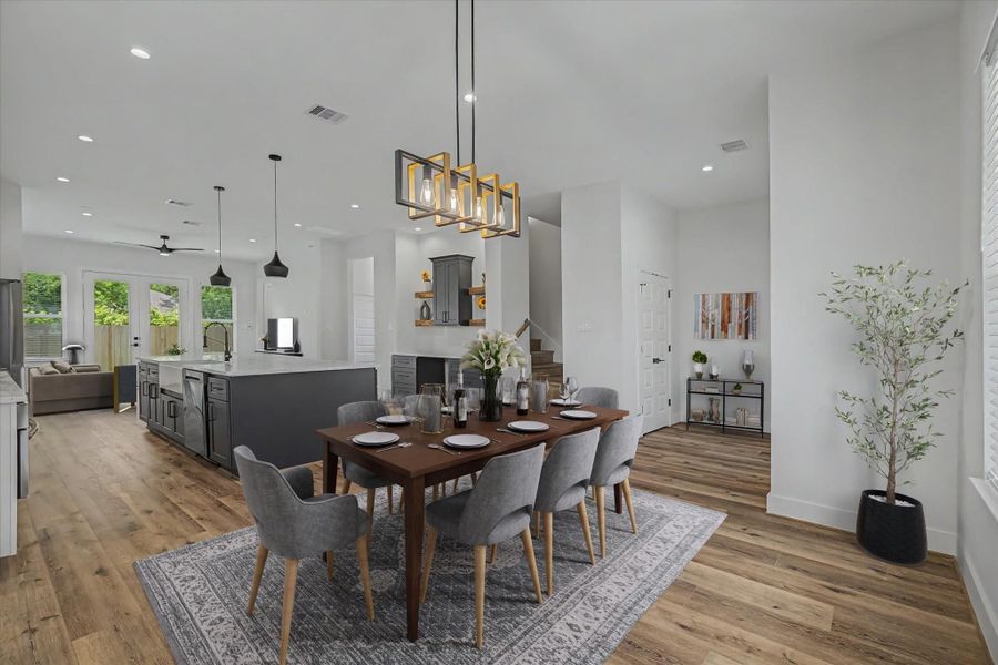 Virtually staged dining area and entry foyer.