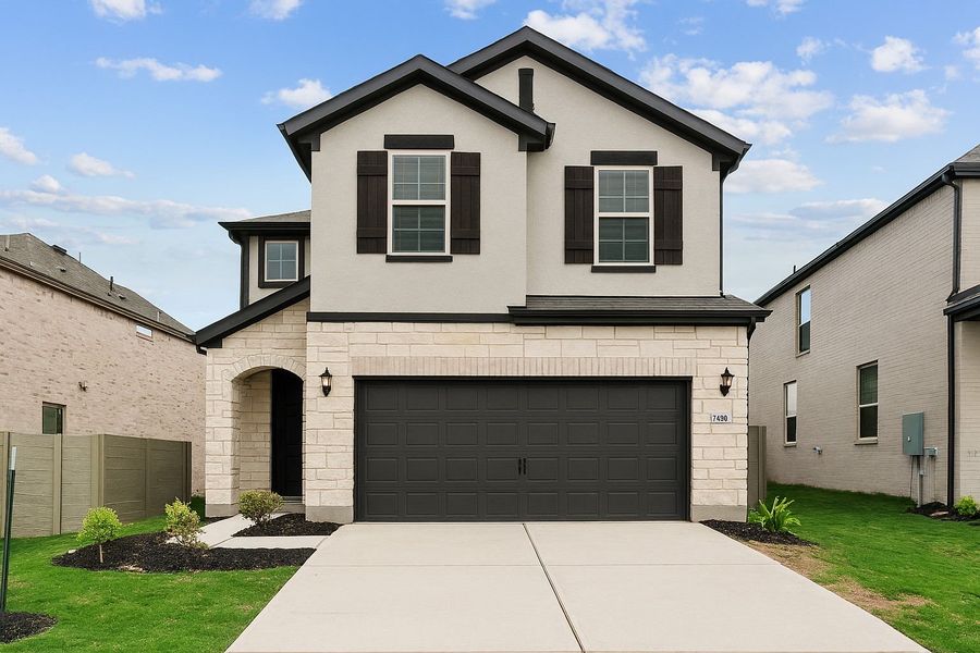 Front exterior of a new home in Wolf Ranch, Georgetown, TX, highlighting curb appeal (Image 1). Front exterior of a new home in Wolf Ranch, Georgetown, TX, highlighting curb appeal (Image 1).