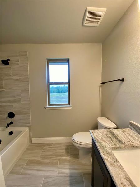 Bath 2  with window for natural light is shared by beds 2 & 3.