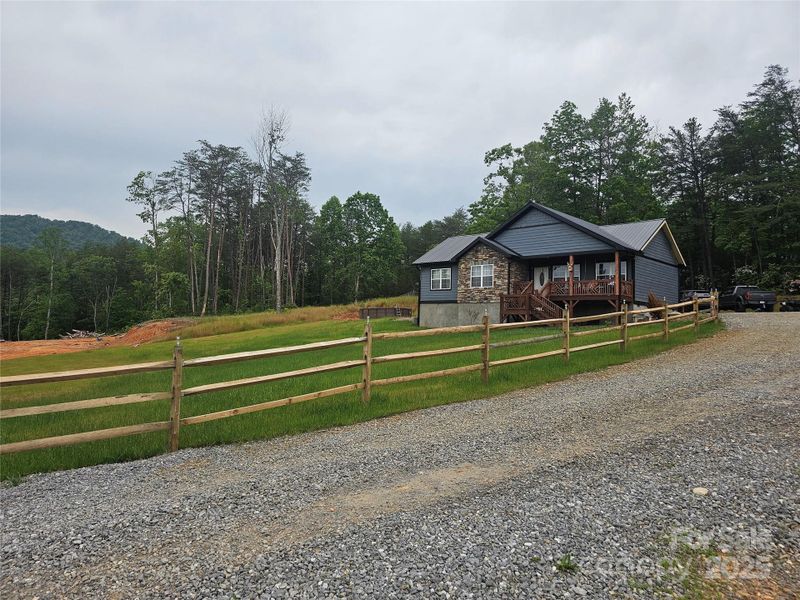 Front exterior of a new home in , Old Fort, NC, highlighting curb appeal (Image 1).