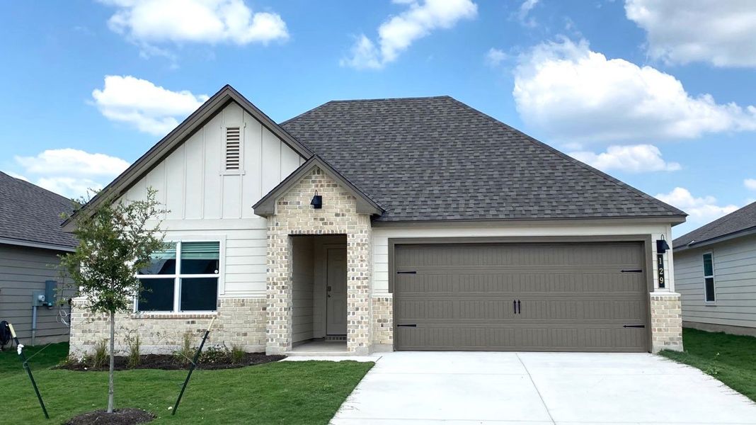 Front exterior of a new home in Eastern Wells, Jarrell, TX, highlighting curb appeal (Image 2). Front exterior of a new home in Eastern Wells, Jarrell, TX, highlighting curb appeal (Image 2).