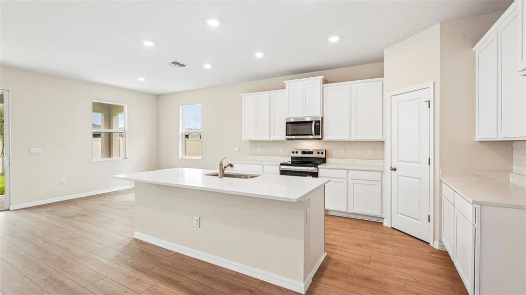 Furnished interior view inside a new home in Bella Lago, Parrish (Image 4).