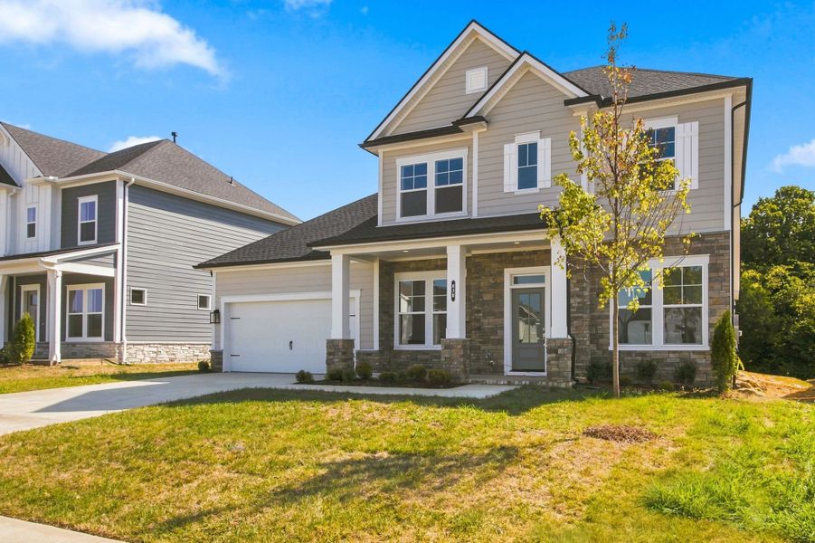 Front exterior of a new home in Heritage Green – The Signature Collection, Columbia, TN, highlighting curb appeal (Image 2). Front exterior of a new home in Heritage Green – The Signature Collection, Columbia, TN, highlighting curb appeal (Image 2).
