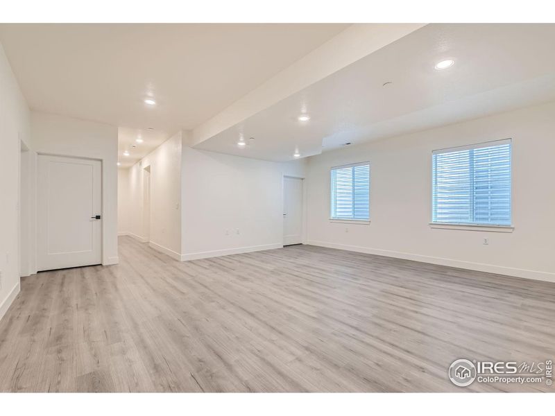 Large basement rec-room with lots of light and high ceilings.