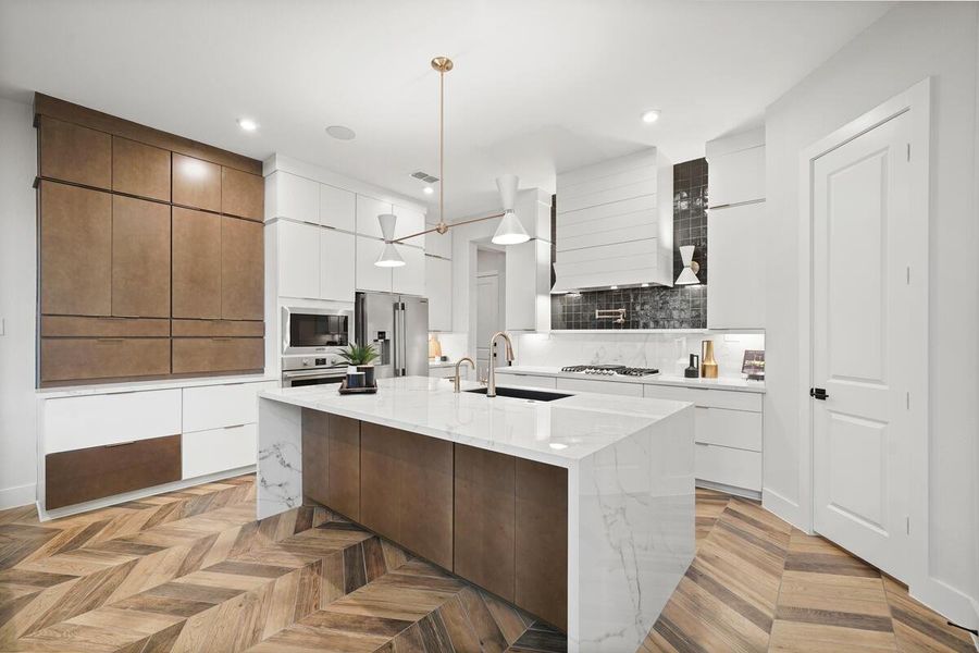 Here you can see the gourmet kitchen with space for a breakfast table. Representative image.