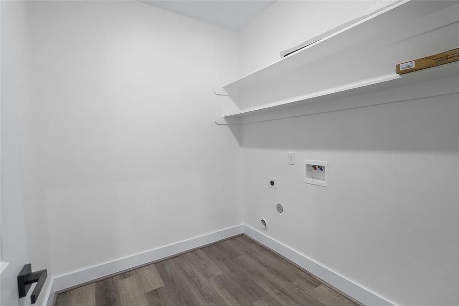 Spacious laundry room conveniently located in the home.