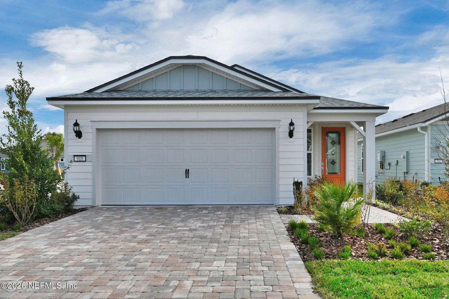 Front exterior of a new home in Del Webb Wildlight, Yulee, FL, highlighting curb appeal (Image 27). Front exterior of a new home in Del Webb Wildlight, Yulee, FL, highlighting curb appeal (Image 27).